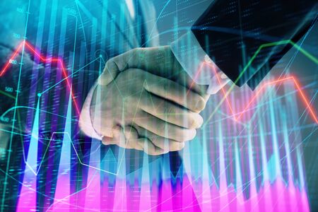 Multi exposure of forex graph on abstract background with two businessmen handshake. Concept of success on stock marketの写真素材