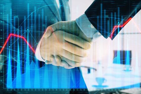 Multi exposure of financial graph on office background with two businessmen handshake. Concept of success in businessの写真素材