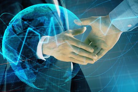 Multi exposure of forex graph and world map on abstract background with two businessmen handshake. Concept of success on international marketsの写真素材