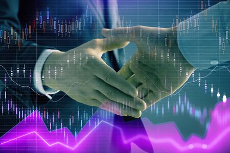 Multi exposure of forex graph on abstract background with two businessmen handshake. Concept of success on stock marketの写真素材