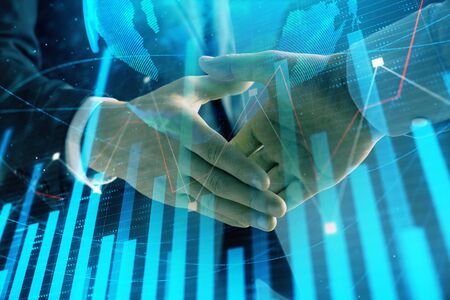 Multi exposure of forex graph and world map on abstract background with two businessmen handshake. Concept of success on international marketsの写真素材