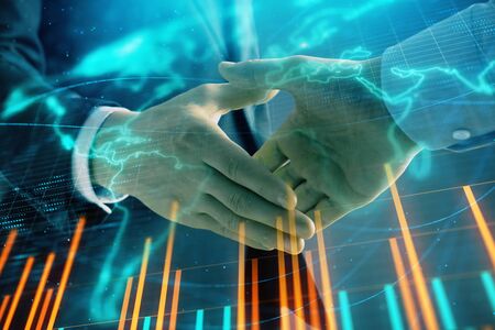 Multi exposure of forex graph and world map on abstract background with two businessmen handshake. Concept of success on international marketsの写真素材