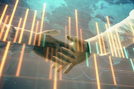 Multi exposure of forex graph and world map on abstract background with two businessmen handshake. Concept of success on international marketsの写真素材