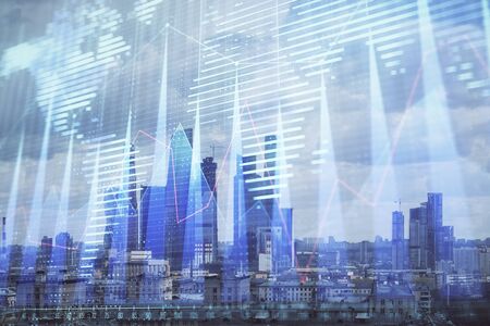 Double exposure of financial graph and world map on city veiw background. Concept of financial market research and analysisの写真素材