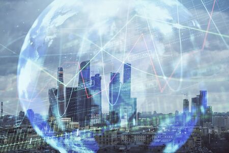 Double exposure of financial graph and world map on city veiw background. Concept of financial market research and analysisの写真素材