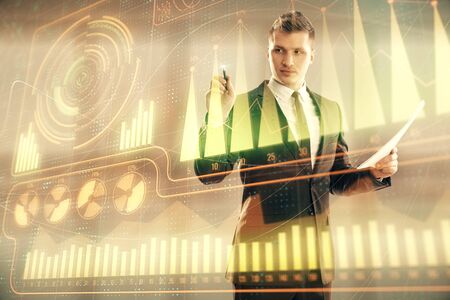Businessman standing with business theme hologram. Multi exposure. Concept of analysisの写真素材