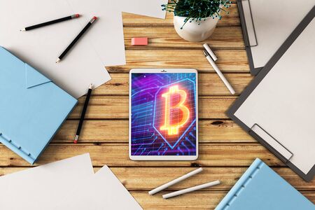 Digital tablet closeup with bitcoin theme picture on screen. Blockchain technology concept. 3d rendering.の写真素材