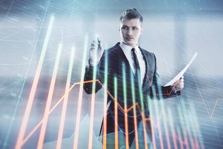 Businessman and forex graph hologram. Double exposure. Concept of financial education and analysis