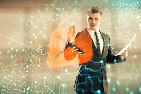 Businessman and lock icon hologram. Double exposure. Concept of data securityの写真素材