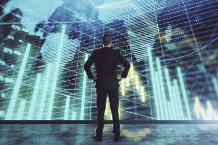 Businessman and forex graph and world map hologram. Double exposure. Concept of financial education and analysisの写真素材