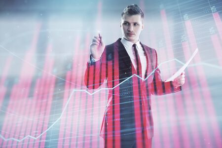 Businessman and forex graph hologram. Double exposure. Concept of financial education and analysisの写真素材