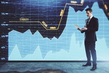 Businessman and forex graph hologram. Double exposure. Concept of financial education and analysisの写真素材