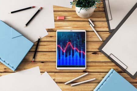 Digital tablet closeup top view with financial graph on screen. Online trading application concept. 3d rendering.の写真素材