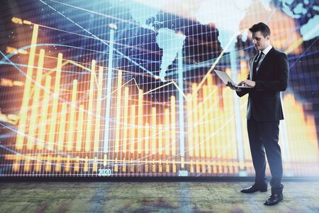 Businessman and forex graph and world map hologram. Double exposure. Concept of financial education and analysisの写真素材
