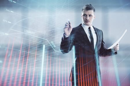 Businessman and forex graph hologram. Double exposure. Concept of financial education and analysisの写真素材