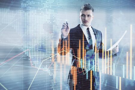 Businessman and forex graph and world map hologram. Double exposure. Concept of financial education and analysisの写真素材