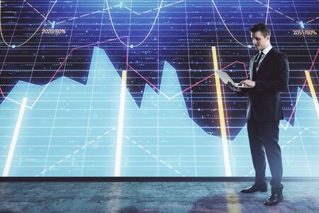 Businessman and forex graph hologram. Double exposure. Concept of financial education and analysisの写真素材