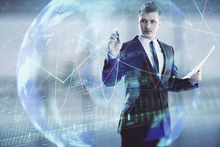 Businessman and forex graph and world map hologram. Double exposure. Concept of financial education and analysisの写真素材