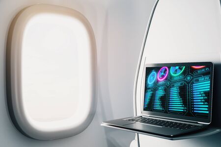 Laptop closeup inside airplane with business theme pic on screen. On air online business concept. 3d rendering.の写真素材