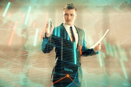Businessman and forex graph and world map hologram. Double exposure. Concept of financial education and analysisの写真素材