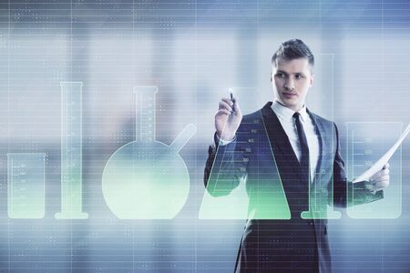 Man and flasks drawing hologram. Double exposure. Concept of educationの写真素材