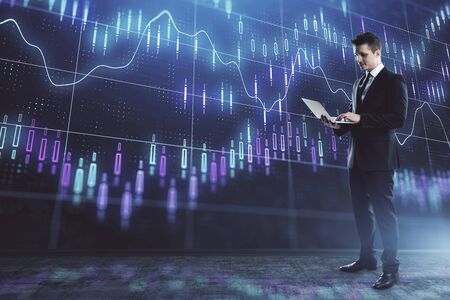 Businessman and forex graph hologram. Double exposure. Concept of financial education and analysisの写真素材