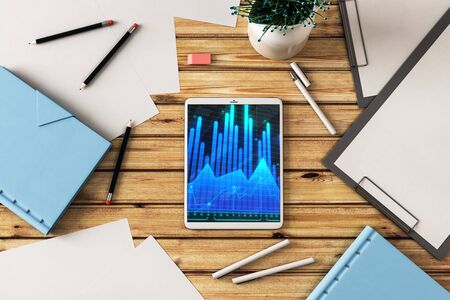 Digital tablet closeup top view with financial graph on screen. Online trading application concept. 3d rendering.の写真素材
