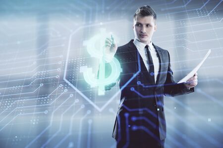 Businessman standing with business theme hologram. Multi exposure. Concept of analysisの写真素材