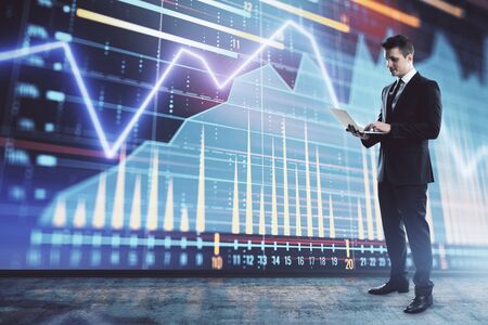 Businessman and forex graph hologram. Double exposure. Concept of financial education and analysisの写真素材