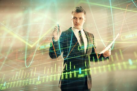 Businessman and forex graph hologram. Double exposure. Concept of financial education and analysisの写真素材