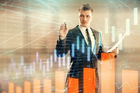 Businessman and forex graph hologram. Double exposure. Concept of financial education and analysisの写真素材