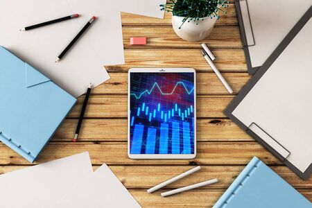 Digital tablet closeup top view with financial graph on screen. Online trading application concept. 3d rendering.の写真素材