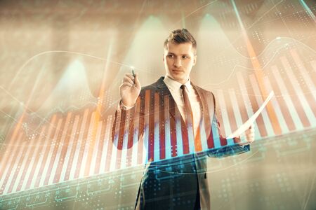 Businessman and forex graph hologram. Double exposure. Concept of financial education and analysisの写真素材