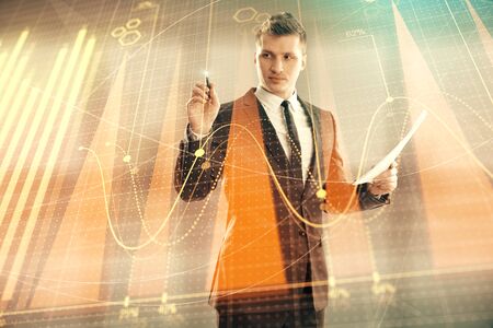 Businessman and forex graph hologram. Double exposure. Concept of financial education and analysisの写真素材