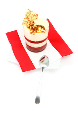 Milk dessert with spoon on red napkin and white backgroundの写真素材