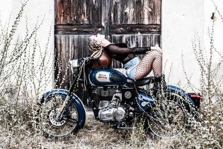 girl and Royal Enfield 500 motorbike, balearic islandsのeditorial素材