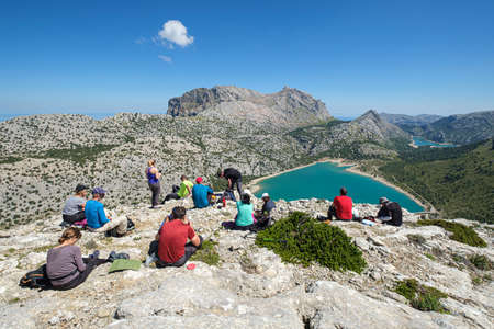 group of hikers in front of the Cuber reservoir, Mallorca, Balearic Islands, Spainのeditorial素材