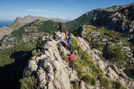 hikers ascending to Puig de Ses Vinyes by the northeast ridge, Escorca, Mallorca, Balearic Islands, Spainのeditorial素材
