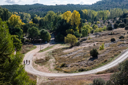 three cyclists on a road, Siguenza, Guadalajara, Spainのeditorial素材