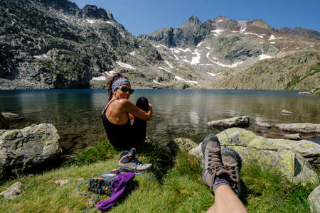 feet in boots relaxing, Ibones azul and BachimaÃ±a alto route, Huesca province, Spainのeditorial素材