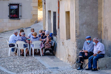 older people playing cards, Market Street, FrÃ­as, Autonomous Community of Castilla y LeÃ³n, Spainのeditorial素材