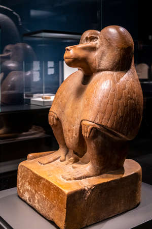 figure of a squatting baboon, red quartzite, 18th dynasty reigning Amenhotep III, collection of the...