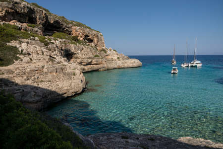 yachts at anchor, Cala Marmols, Ses Salines, mallorca, balearic islands, spain, europeの写真素材