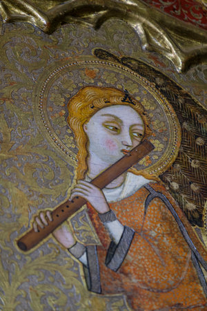 angel with medieval transverse flute, Mother of God of humility with musical angels altarpiece, Francesc Comes, 1390-94, Parish of La Mare de Deu dels Angels, pollensa museum, Majorca, Balearic Islands, Spainのeditorial素材