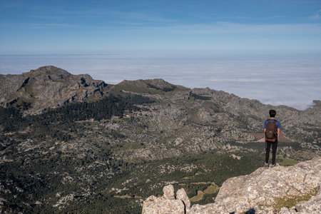 a lone hiker looking up a mountain, Escorca, Mallorca, Balearic Islands, Spainの写真素材
