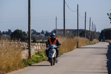 motorcyclist on a country road, Buger, Majorca, Balearic Islands, Spainの写真素材