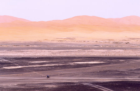 cyclists on the track. Erg Chebi. Merzouga. Tafilalt. Morocco.の写真素材