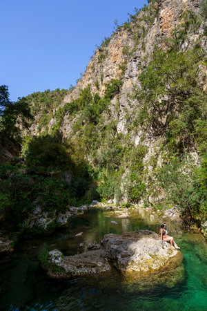 hikers bathing in the river, God's Bridge, Akchour, Talassemtane Nature Park, Rif region, morocco, africaの写真素材