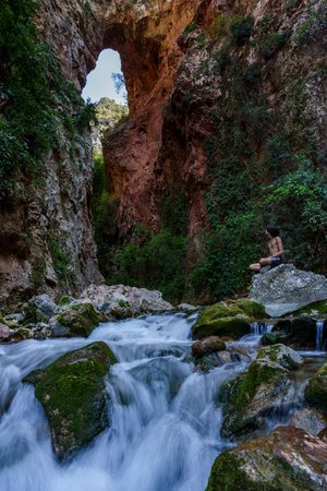 God's Bridge, hiker, Akchour, Talassemtane Nature Park, Rif region, morocco, africaの写真素材