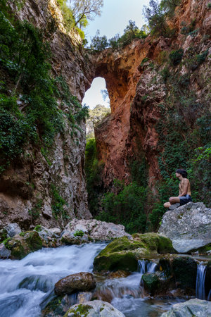 God's Bridge, hiker, Akchour, Talassemtane Nature Park, Rif region, morocco, africaの写真素材